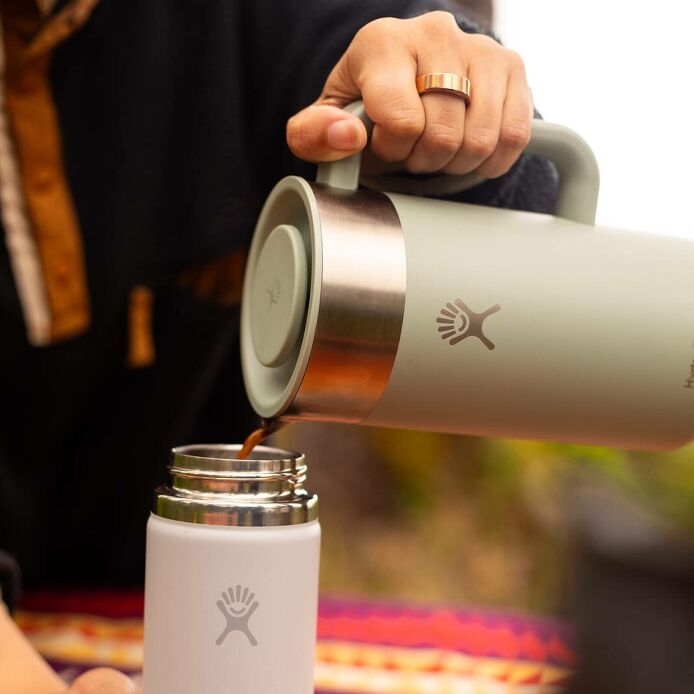 32-oz-insulated-french-press-q0 2706_johnson_s25summertravel_camping_pouring_303a0287_1_.jpg